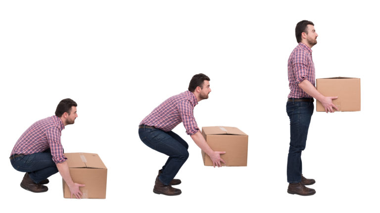 A person lifting a heavy box correctly.